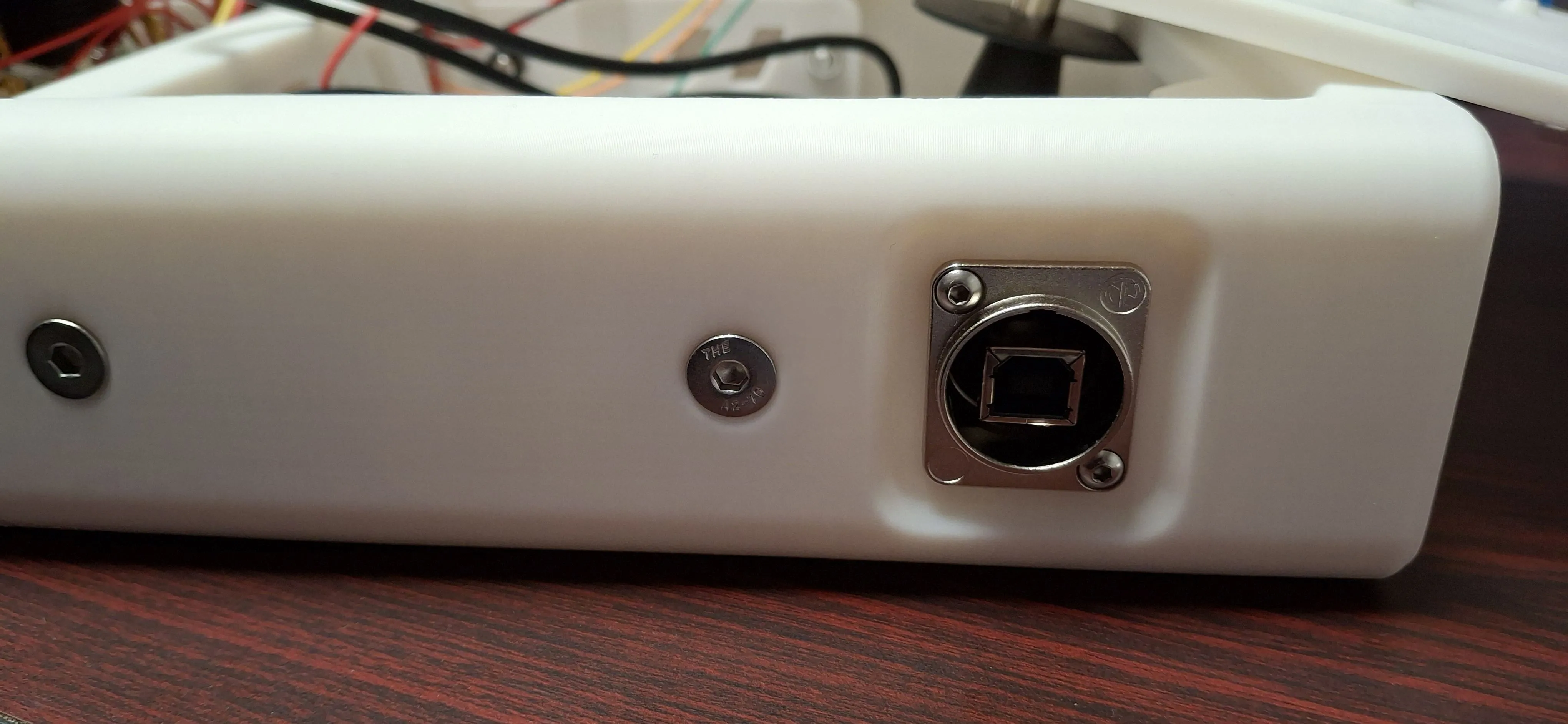 a Neutrik USB-B panel pass-through adapter in the back of the controller